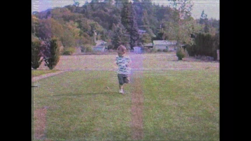 A child is running on the cut grass