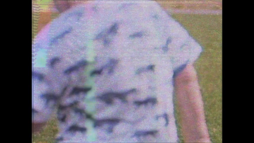 Happy child laughing as he runs across a field