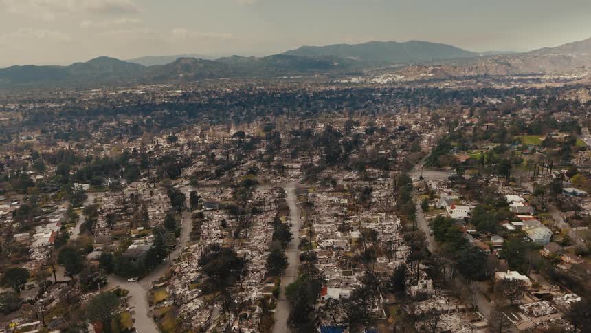 Aerial view of a suburban neighborhood where houses are crammed together