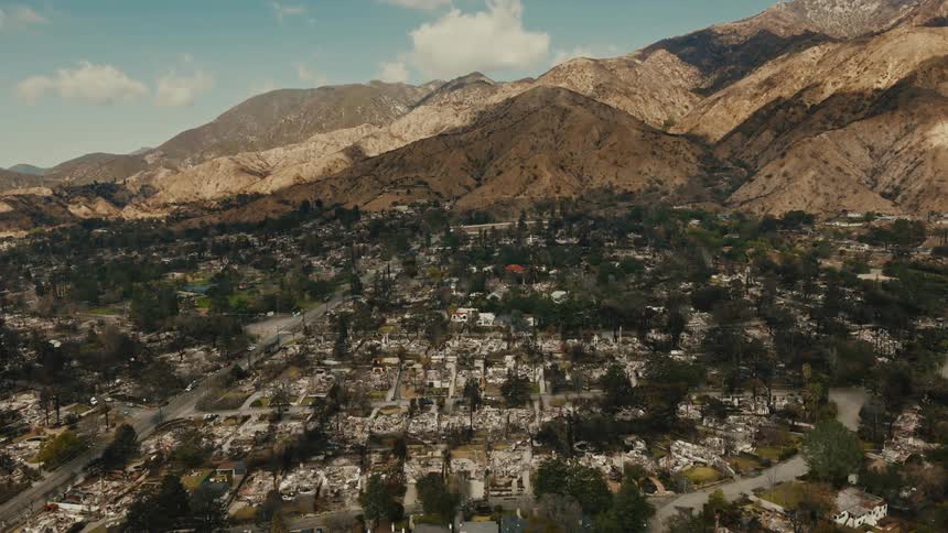Landscape of an urban city with a mountain valley in the background