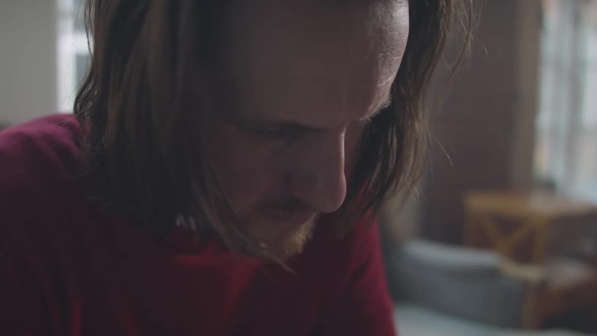 A footage of a man in a depressed state