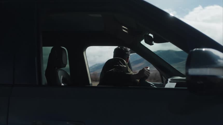 A footage of a man walking out of a car