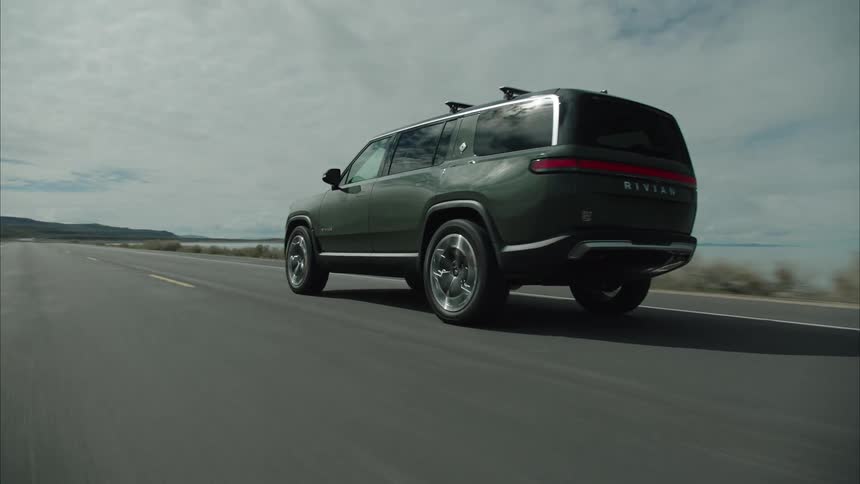 A large sports utility vehicle is on a road trip