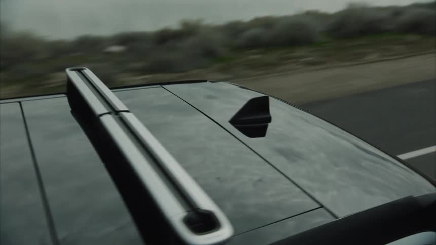 Focus on various details of a car driving down a mountain road