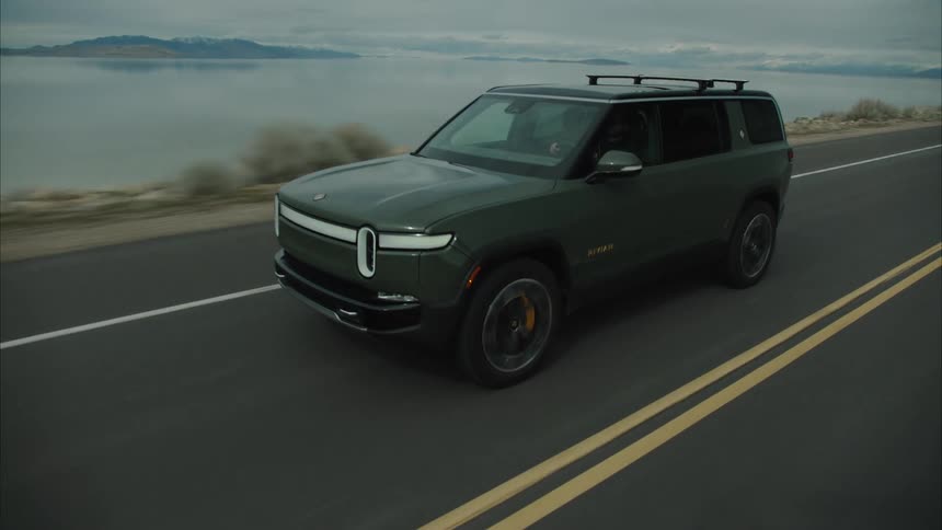 Dark green suv vehicle moving along the road