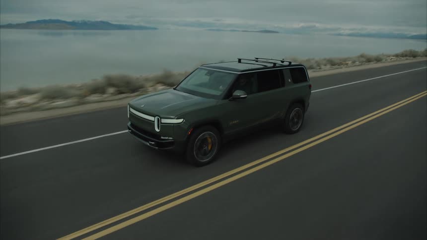 Car driving along a road in a mountainous landscape