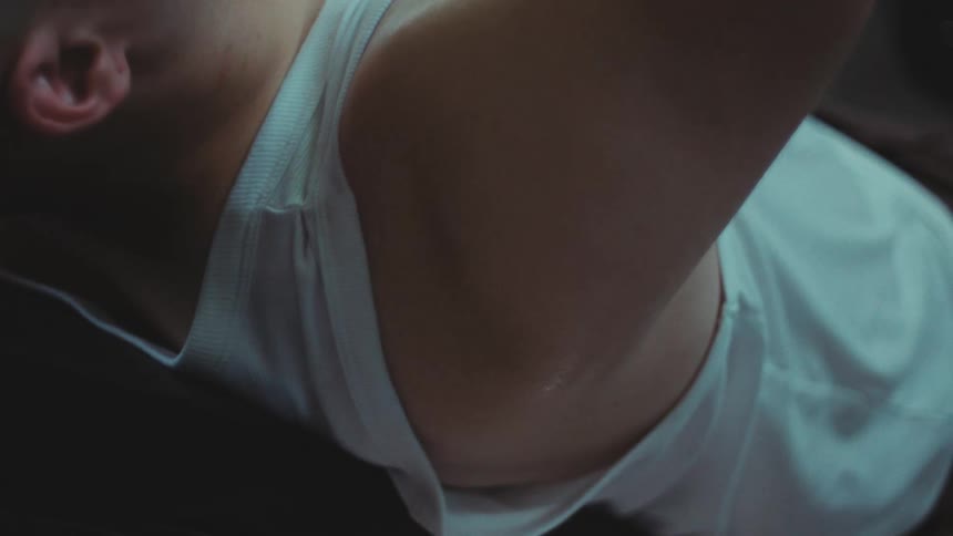 Shoulder of a boy who trains by lifting weights