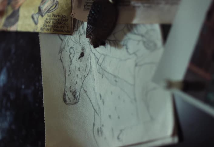 Magnet holds a drawing and clippings on a metal surface