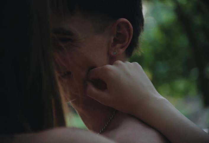 A back footage of a teenage couples having a conversation