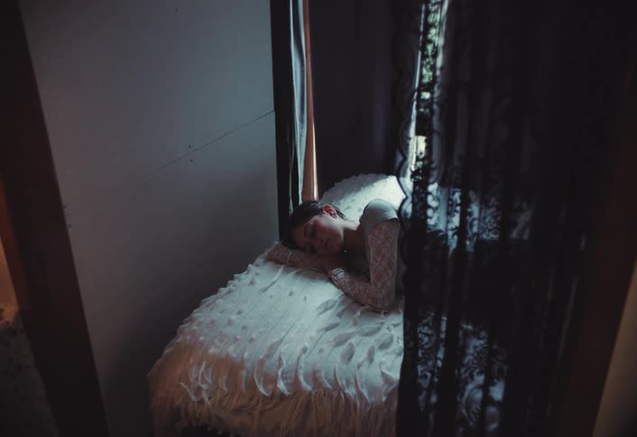 A footage of a person sleeping on a bed