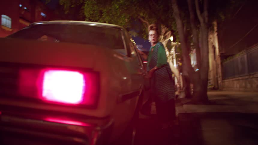 A woman sets off her car alarm while she tries to get in