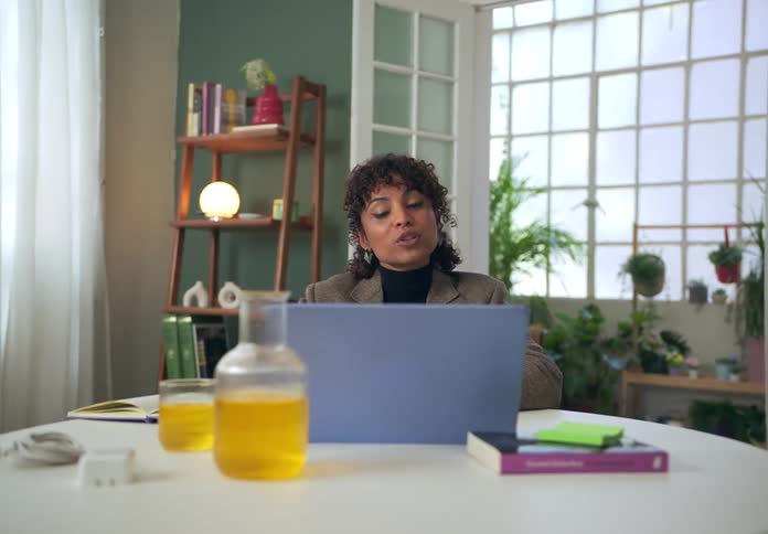 A footage of a person having a phone call conversation indoor