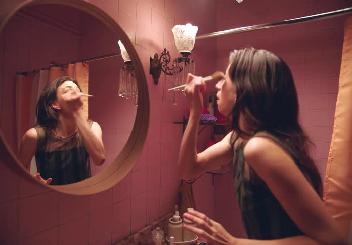 Woman who wears makeup but puts on too much blush and drowns herself