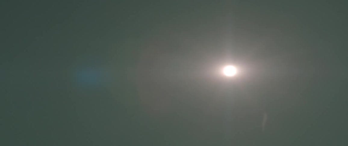 A footage of the sun anda dark cloud