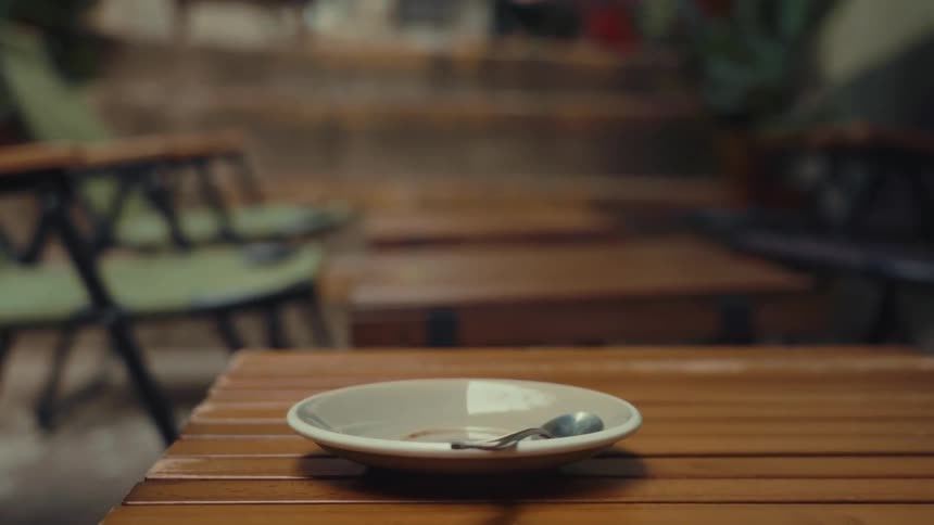A footage of a person lifting a coffee