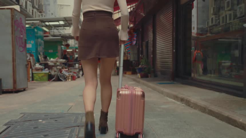 A footage of a person dragging a luggage