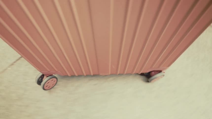 Pink trolley running on a floor