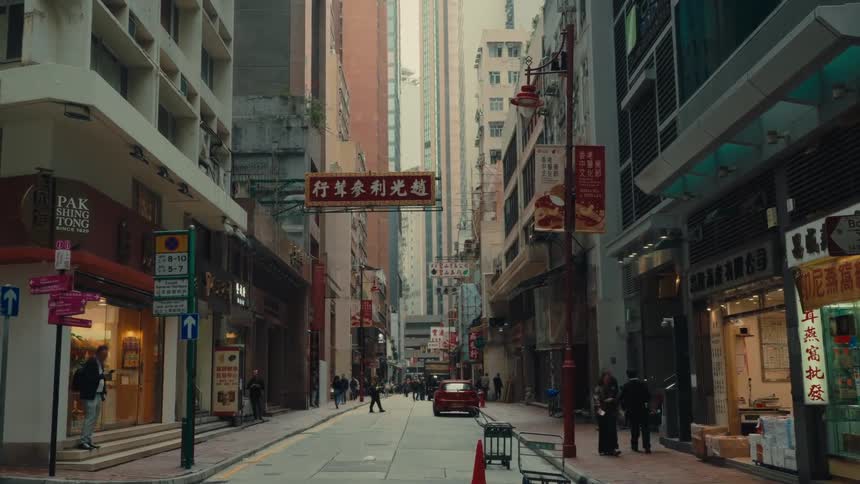 Scene of an alley in a chinese or japanese city where a bus passes in front of the camera
