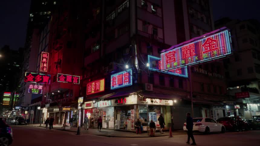The signs on the shops have many flashing lights
