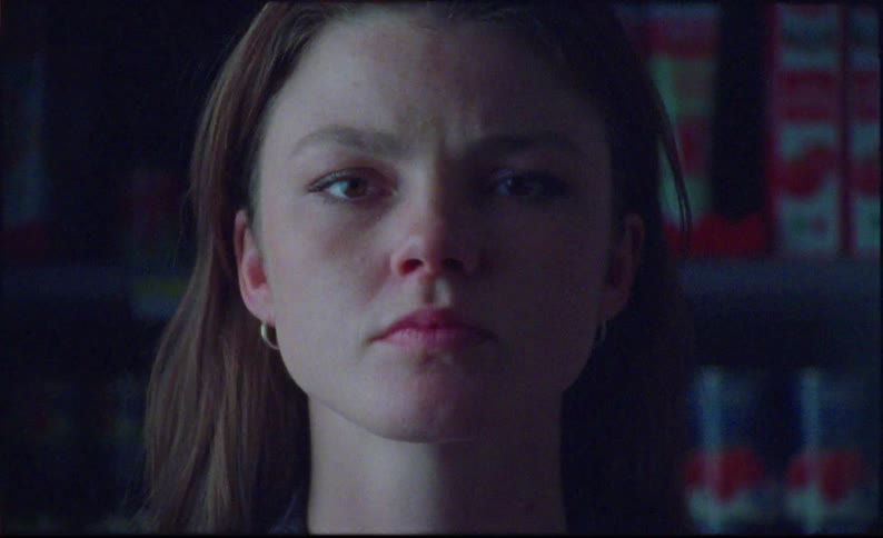 A woman looks angry as she looks up into camera