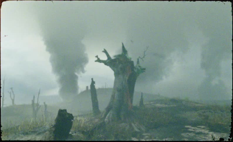 A cg tiger moves with a determined stance through desolated landscape defined by scorched remnants as the camera angle ascends towards a solitary fireravaged trunk