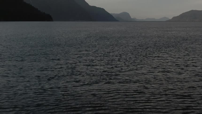 An ocean surrounded by mountains