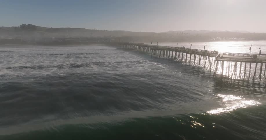 Heavy fog covers the shore