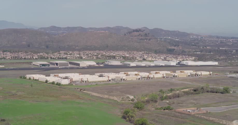 Airplanes are on the runway of an airport outside a city