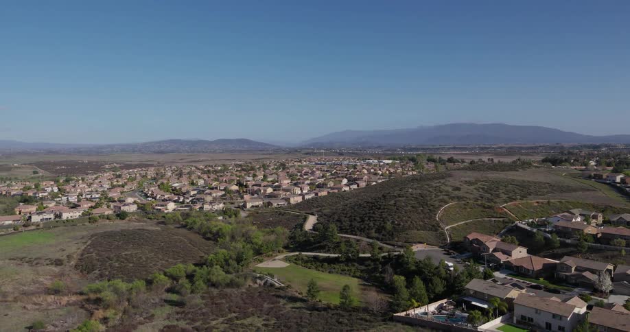 A city sprawls out over the hills