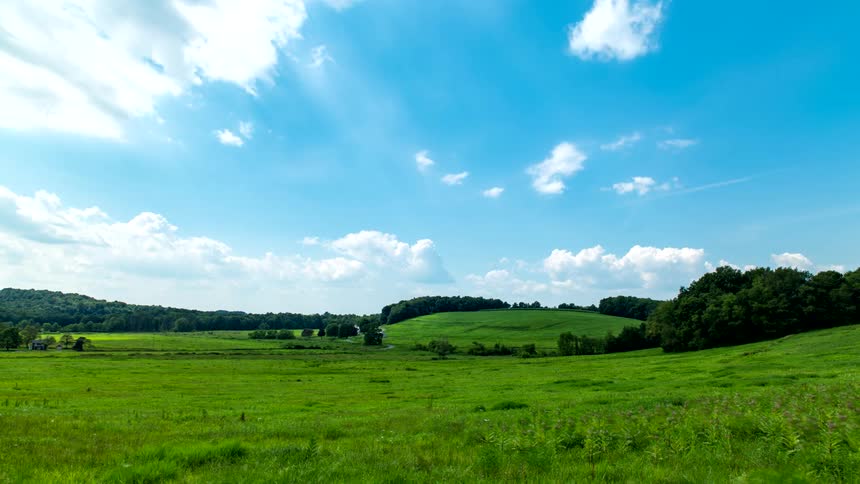 The clouds give shade to the meadow as they pass over