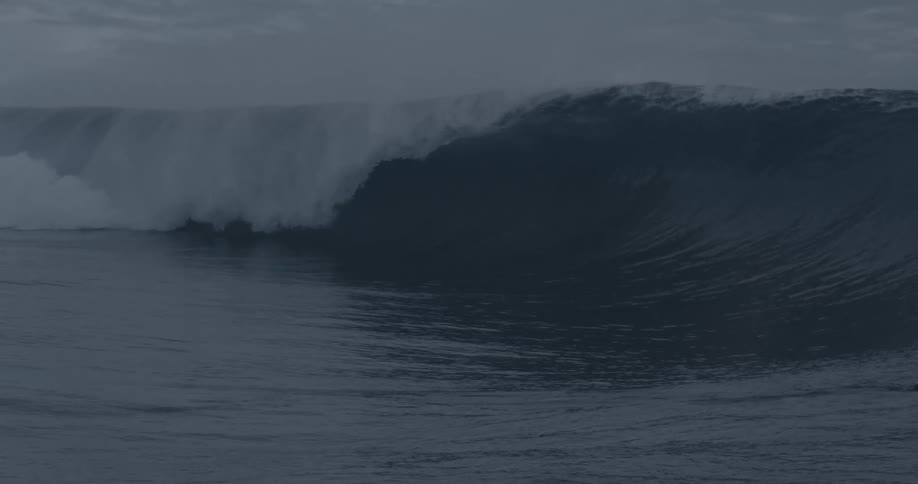Big wave with a person swimming