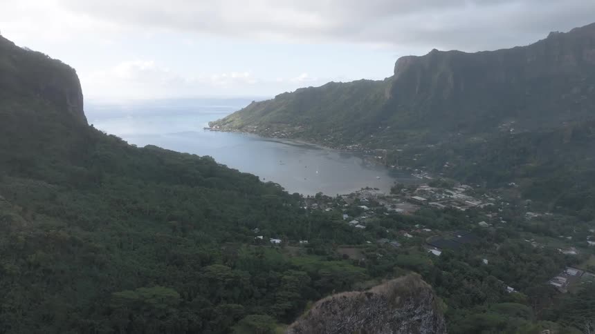 An aerial view of a bay surrounded by cliffs