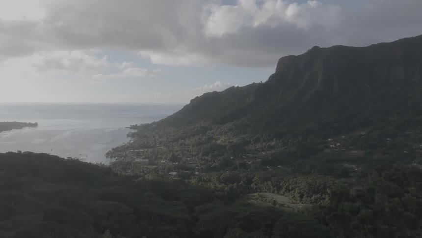 An aerial view of land by the sea