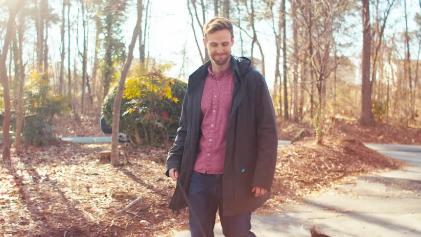 A footage of a person walking a dog