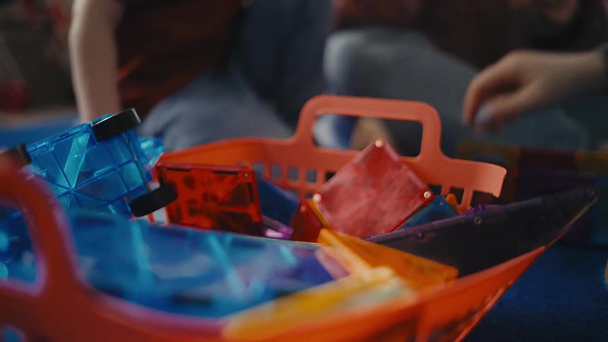 Child playing with toys with someone