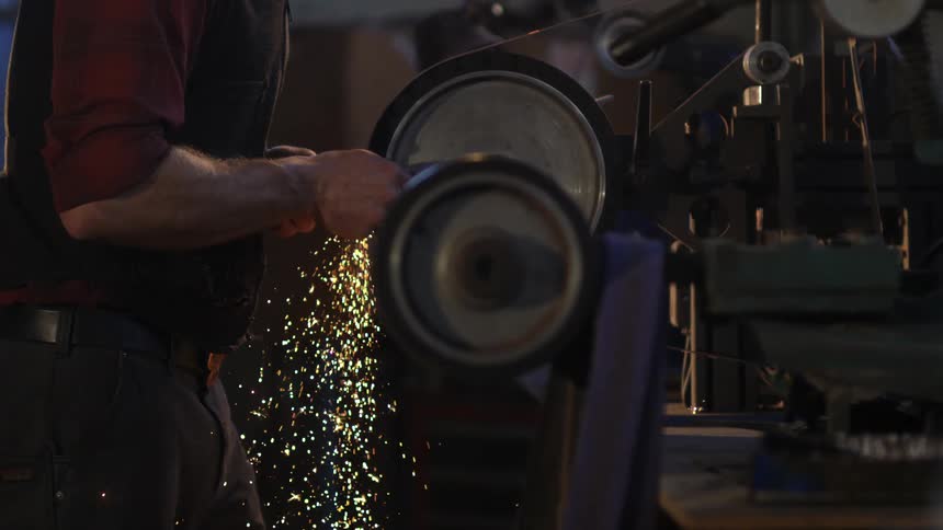A footage of a person working in a forge