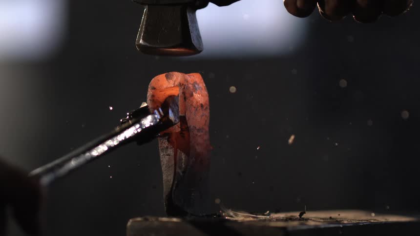 Iron beaten with a hammer and held with pliers