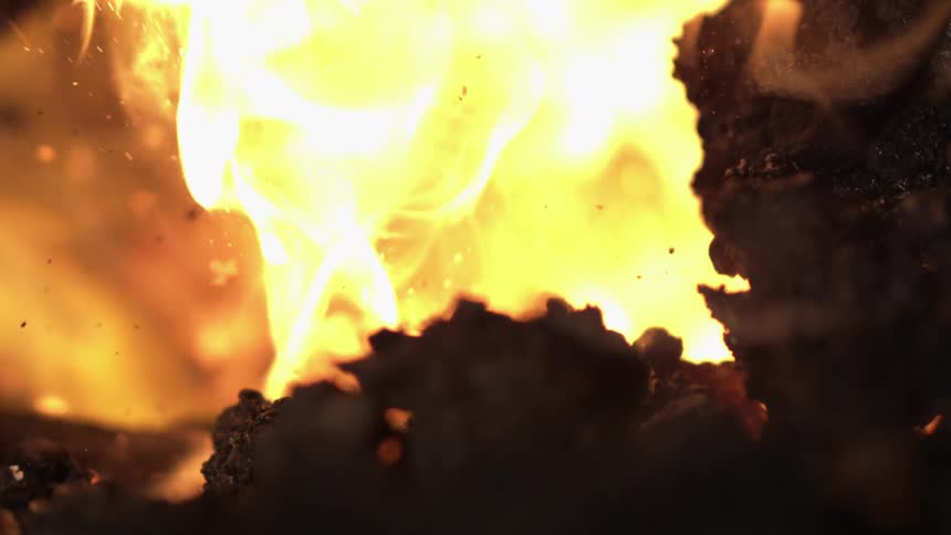 Close up of fire flames with coals around