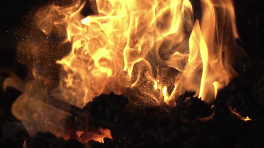 Coal is being mixed in the fires of the forge