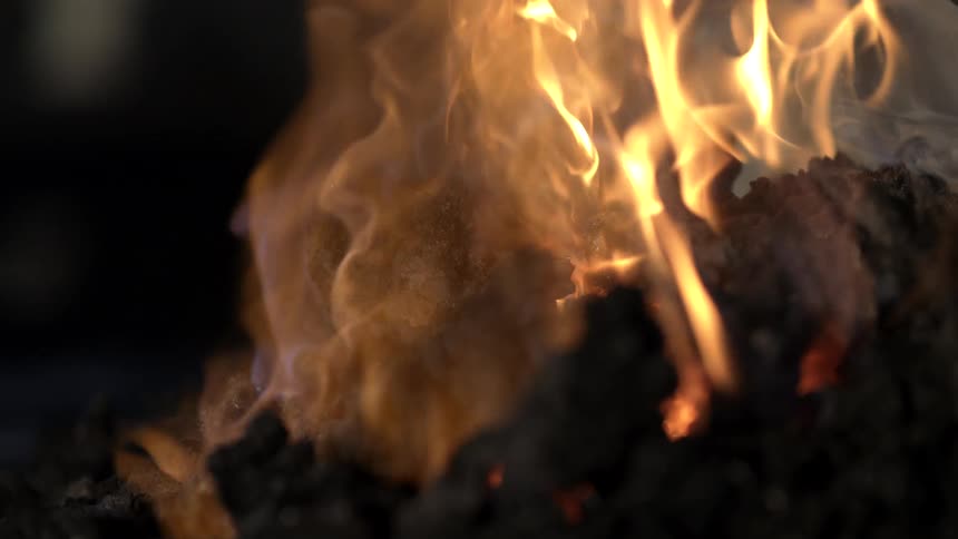 Close up of rising embers of fire