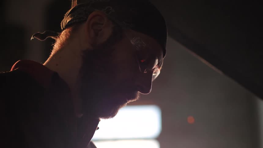 Man with goggles looking concentrated at something