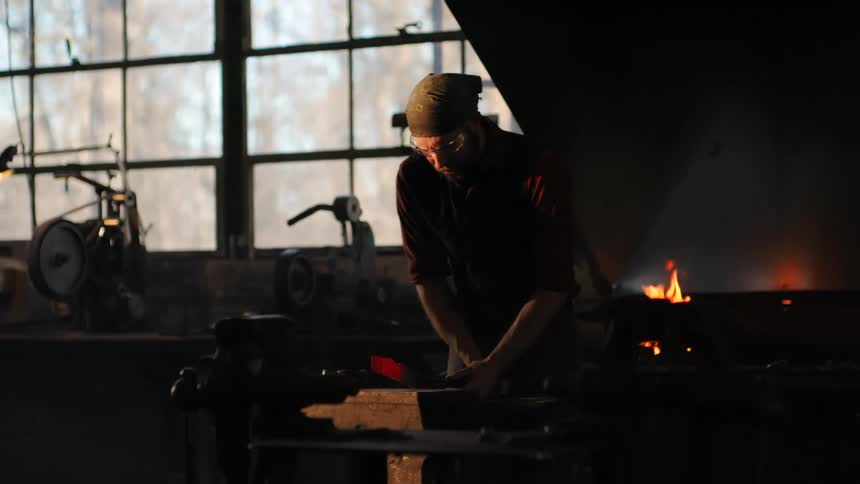 A footage of a blacksmith work ring at the forge
