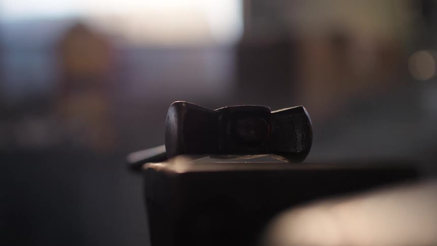 Hammer resting on a table