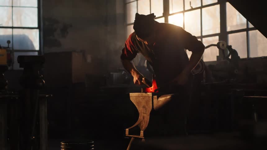 A footage of a person working at a forge