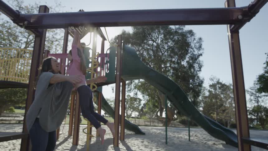 A child playing on a jungle gym