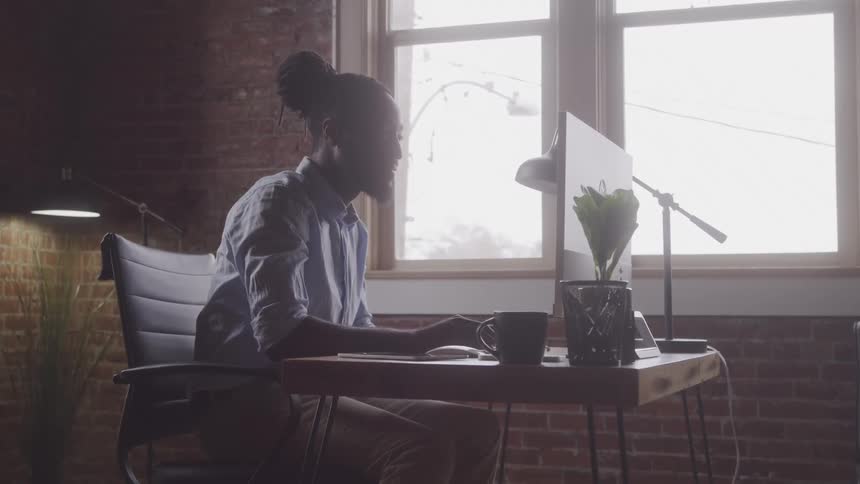 A footage of a person operating a computer