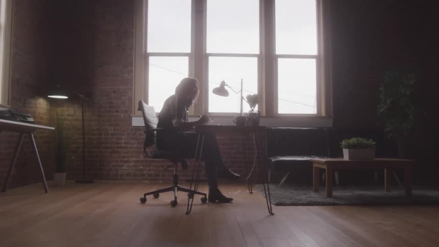 Girl sitting at a desk writing