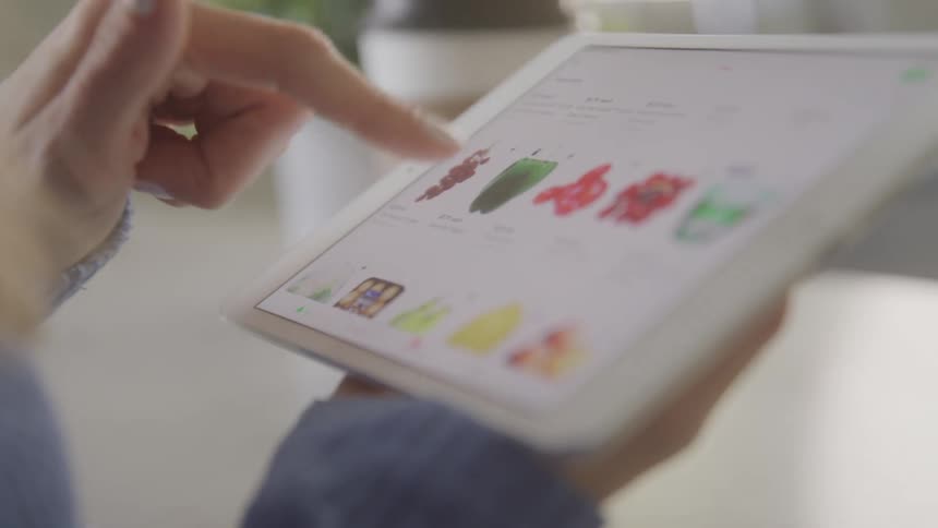 A footage of a person operating a tablet