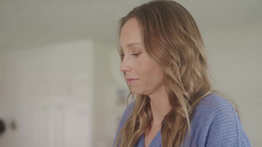 A footage of a lady working on a device