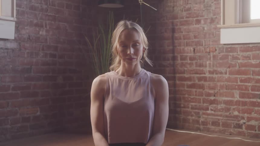 A footage of a lady kneeling on the floor